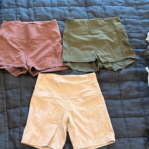 Women's lot of 3 High-Waisted Lululemon Shorts - burgundy, dark Green, and mauve